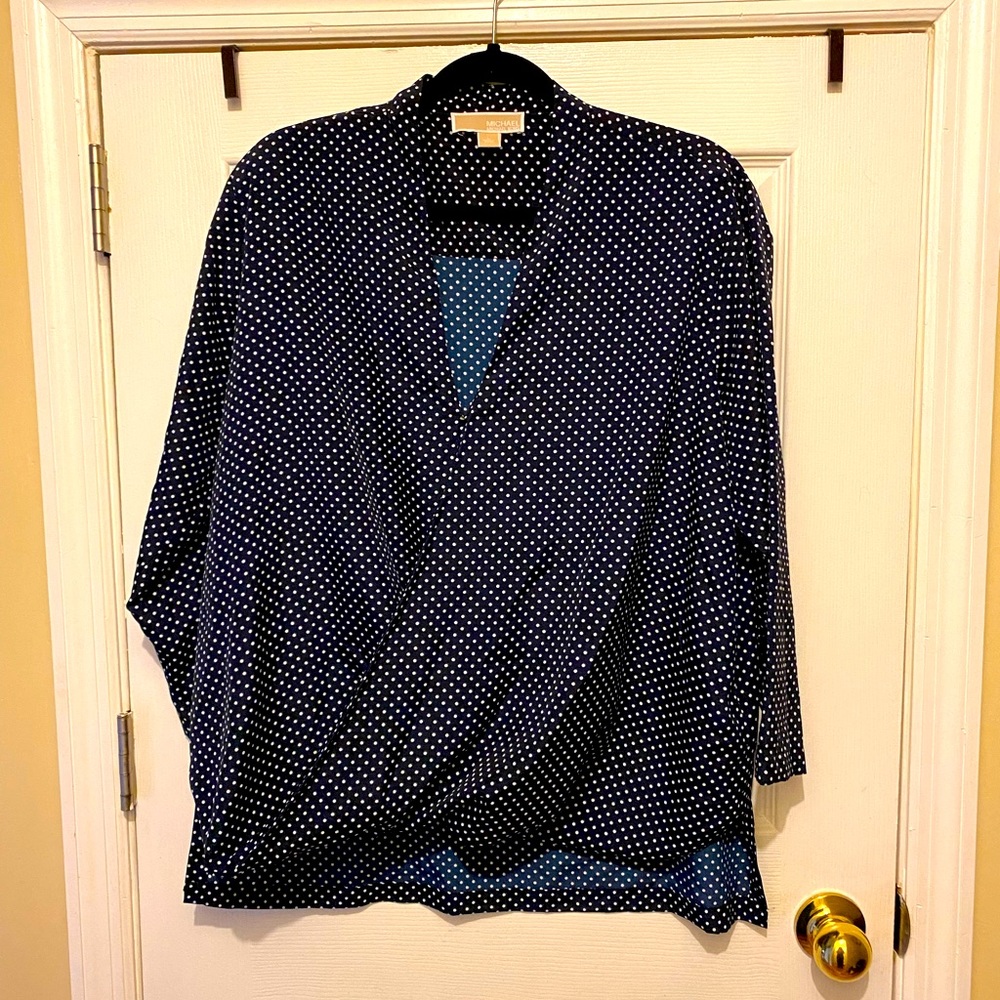 Ladies Michael Kors is top w/hook closure. L sleeve Sz L blue w polka dot NNWT
